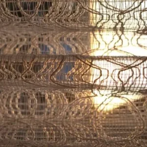 artistic woven curtains with sunlight creating dramatic effect