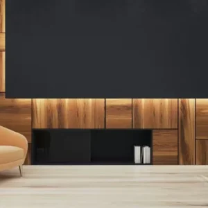 Blackout roller blind in a modern living room with minimal interior design.