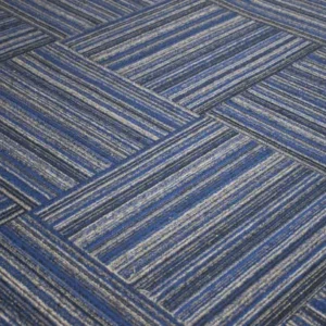 blue patterned carpet tiles arranged in geometric layout for office flooring.