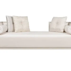 classic leather sofa with wooden legs in traditional interior setting.