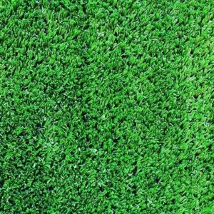close up of dense artificial grass carpet fibers showing realistic texture.