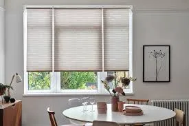 Light-colored linen roller blinds enhancing natural daylight indoors.