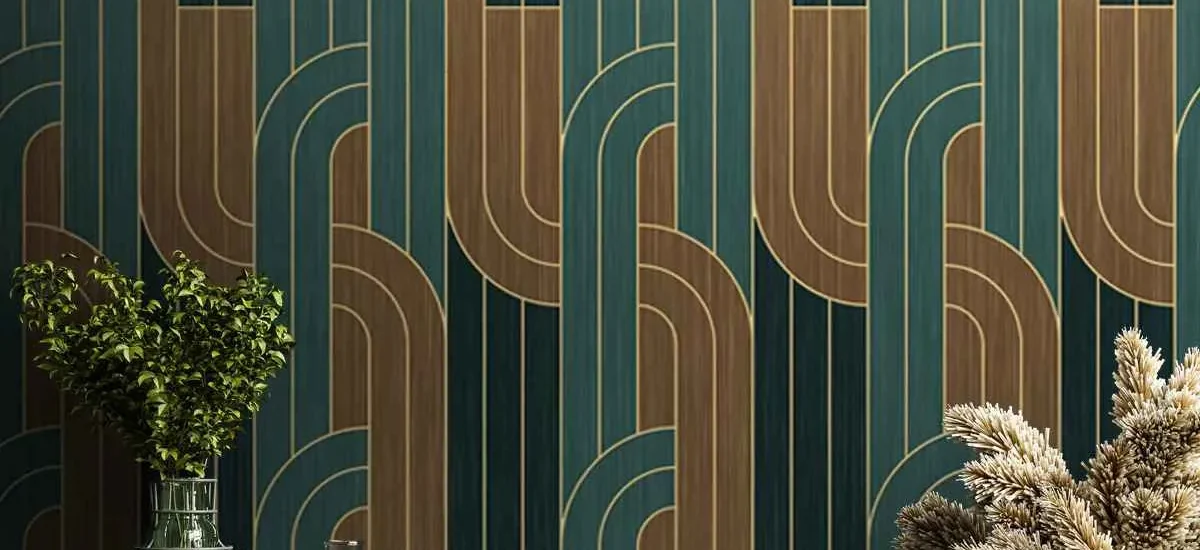 Modern interior with green and gold geometric wallpaper behind decorative plants and table setup in Dubai