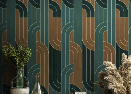 Modern interior with green and gold geometric wallpaper behind decorative plants and table setup in Dubai