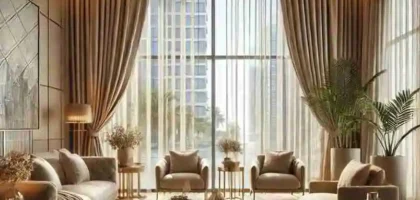Luxury beige blackout curtains covering a large bedroom window in a modern Abu Dhabi apartment interior.