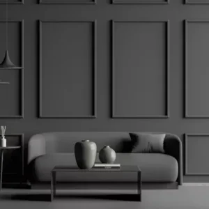 dark wall panel feature wall behind modern sofa and decor setup.