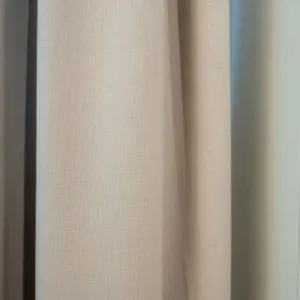 minimal sheer curtain in neutral interior with clean modern styling