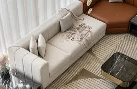 Cream upholstered sofa set in a bright Dubai living room with sheer curtains, wooden coffee table, and flooring.