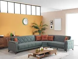 Blue L-shape upholstered sofa in a modern Dubai living room with accent wall and wooden coffee table.