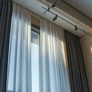 motorized curtains with sheer and blackout layers in modern living room with ceiling track