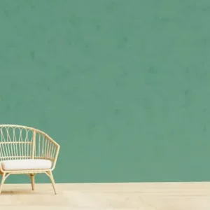 plain green textured wall with modern chair in minimal interior.