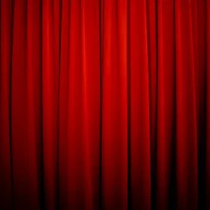 red blackout curtains with deep folds in a luxury interior setting