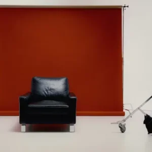 Red blackout roller blind adding bold style to interior decor.