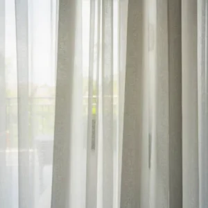 sheer chiffon curtains letting natural light in with balcony view in modern home