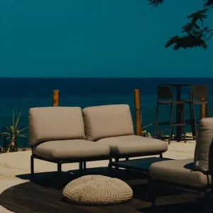terrace sofa with thick padded upholstery cushions for outdoor comfort.