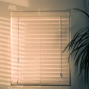 White roller blinds in a living room creating a bright and clean look