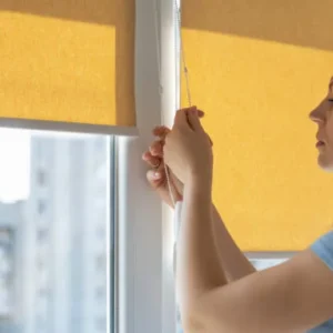 Roller blinds in a kitchen window for practical and clean design