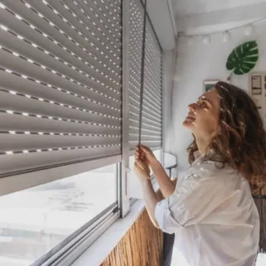 White roller blinds in a living room creating a bright and clean look