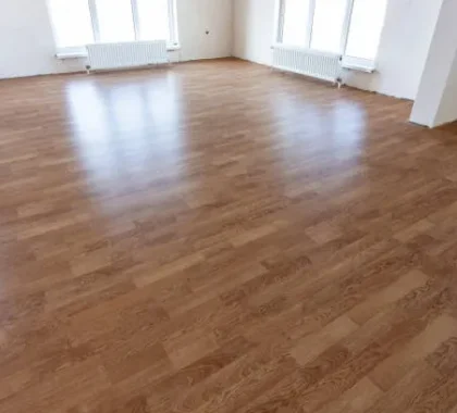wood look vinyl flooring in an empty modern room in Dubai apartment.